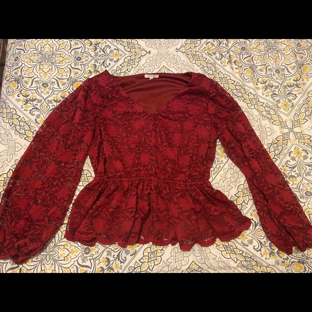 Burgundy lace long sleeve peplum top.